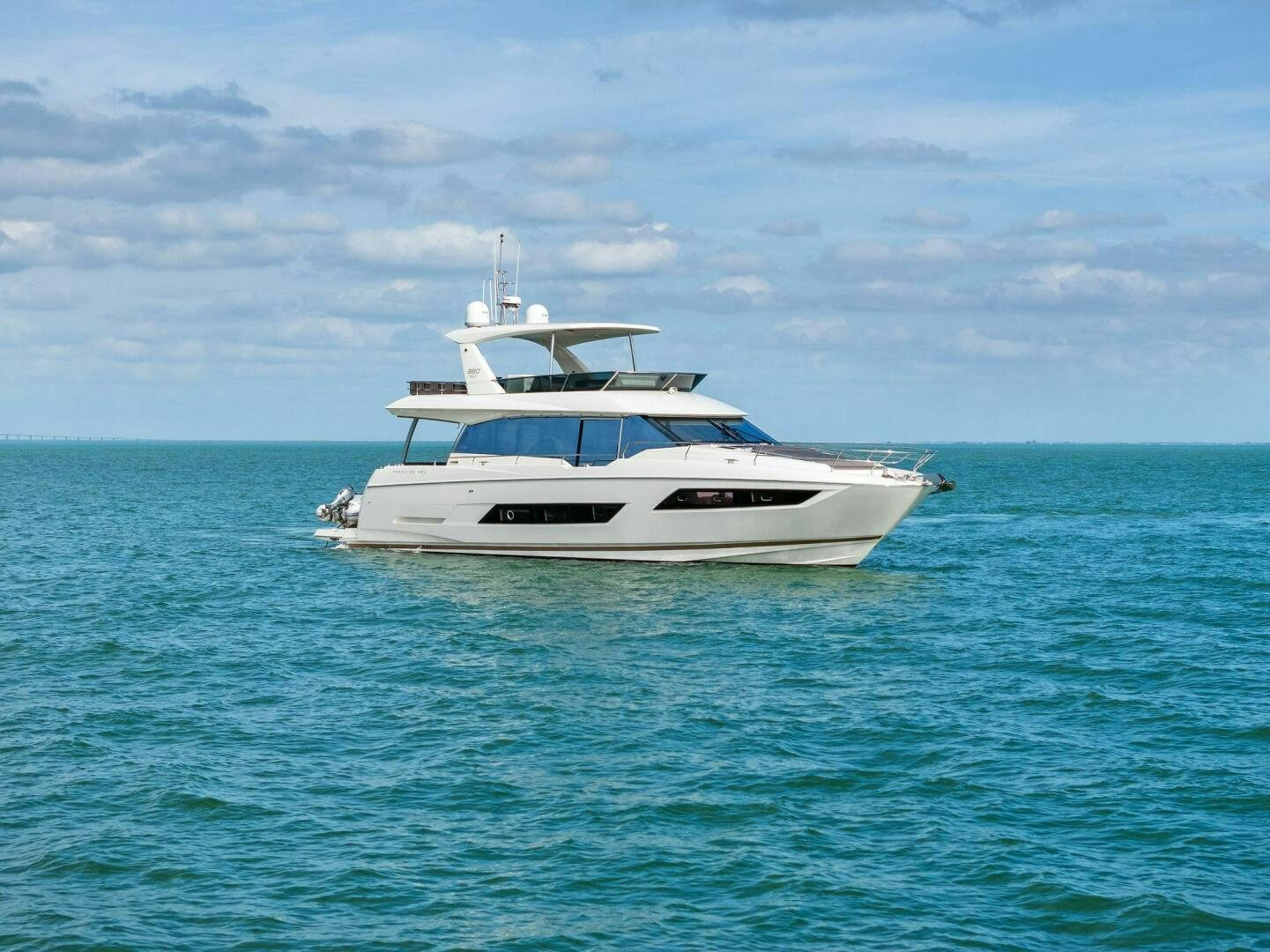 a white boat in the water aboard PRESTIGE WORLDWIDE Yacht for Sale