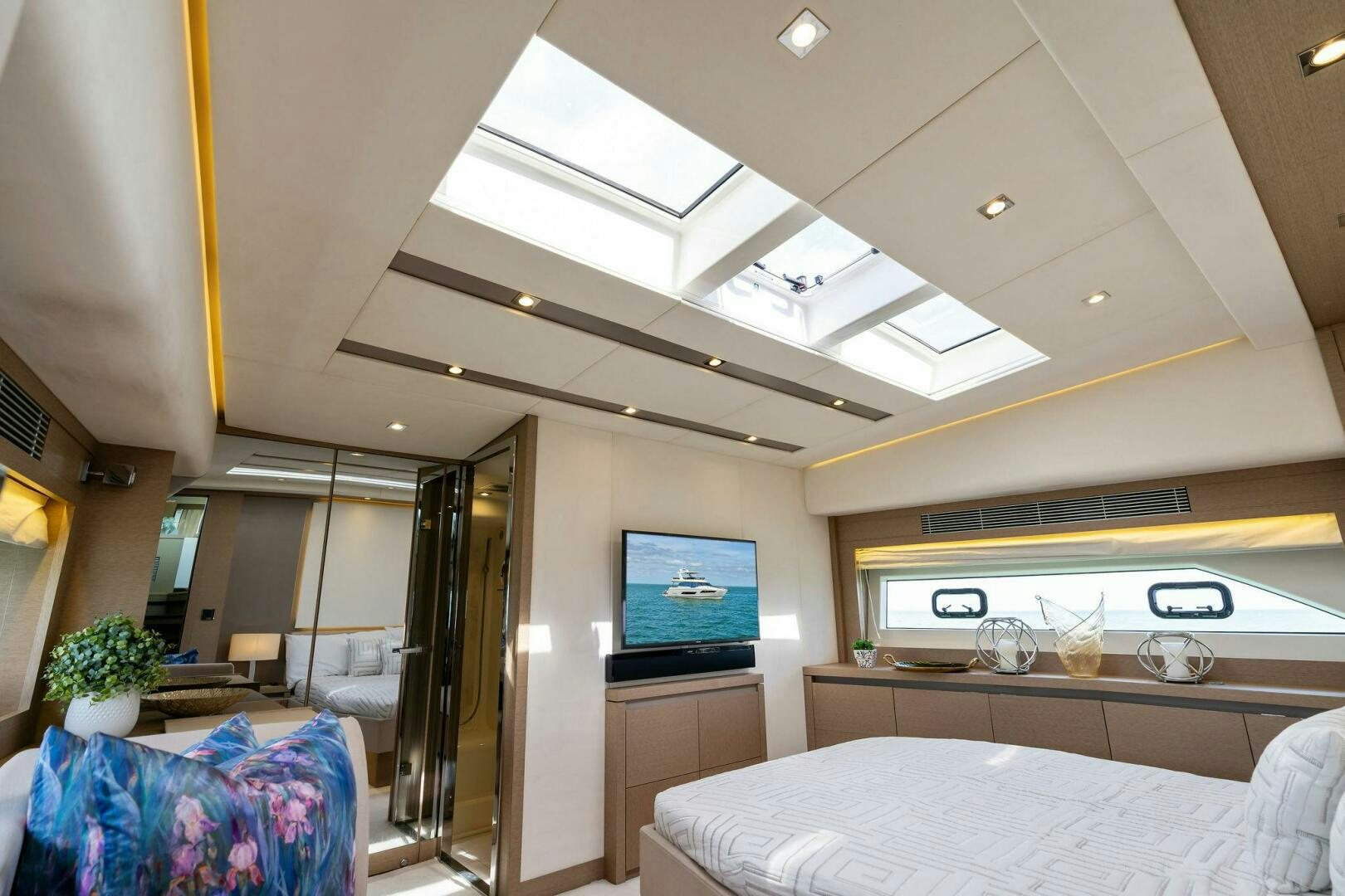 a room with a tv and a bed aboard PRESTIGE WORLDWIDE Yacht for Sale
