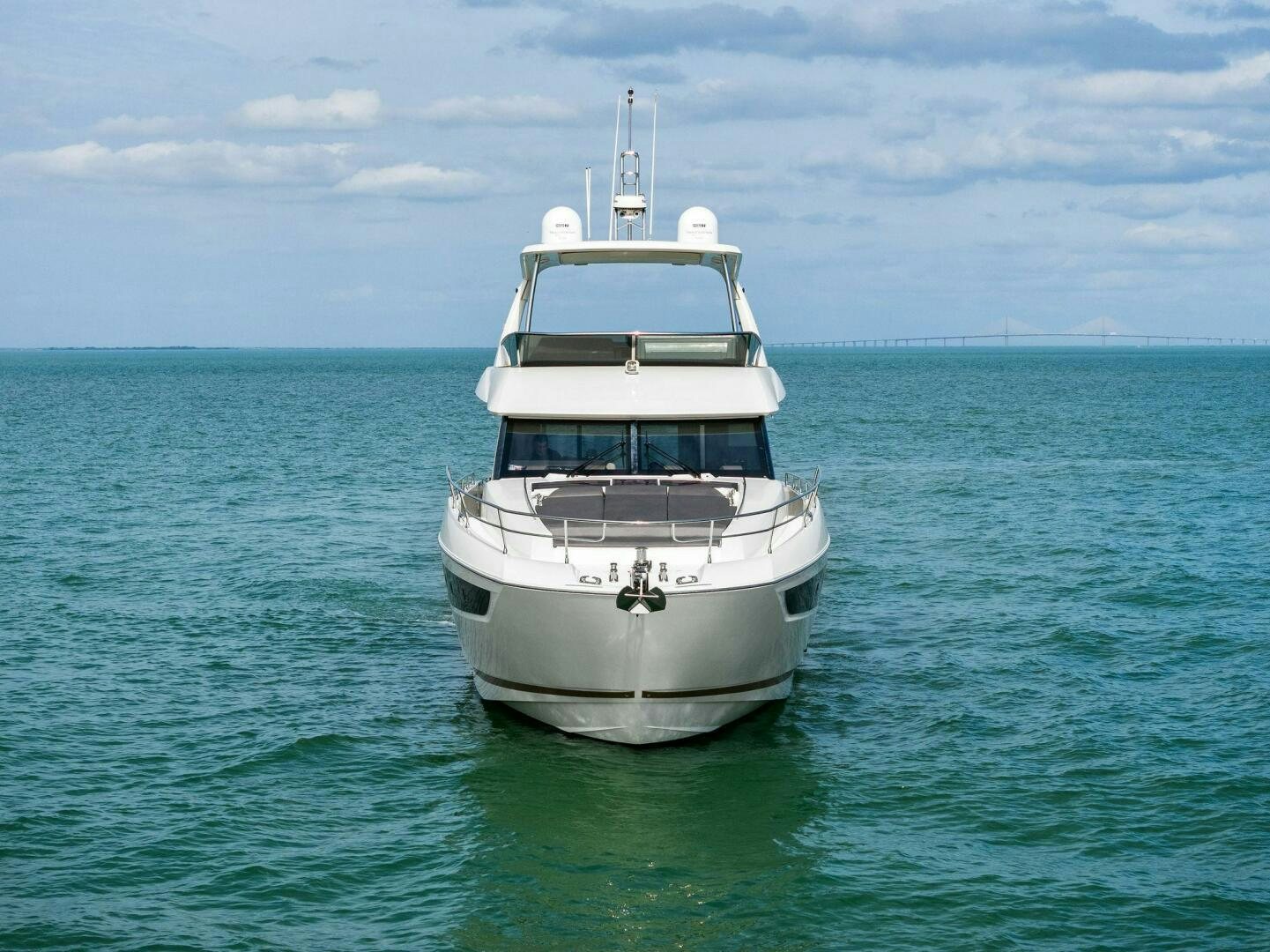 a white boat in the water aboard PRESTIGE WORLDWIDE Yacht for Sale