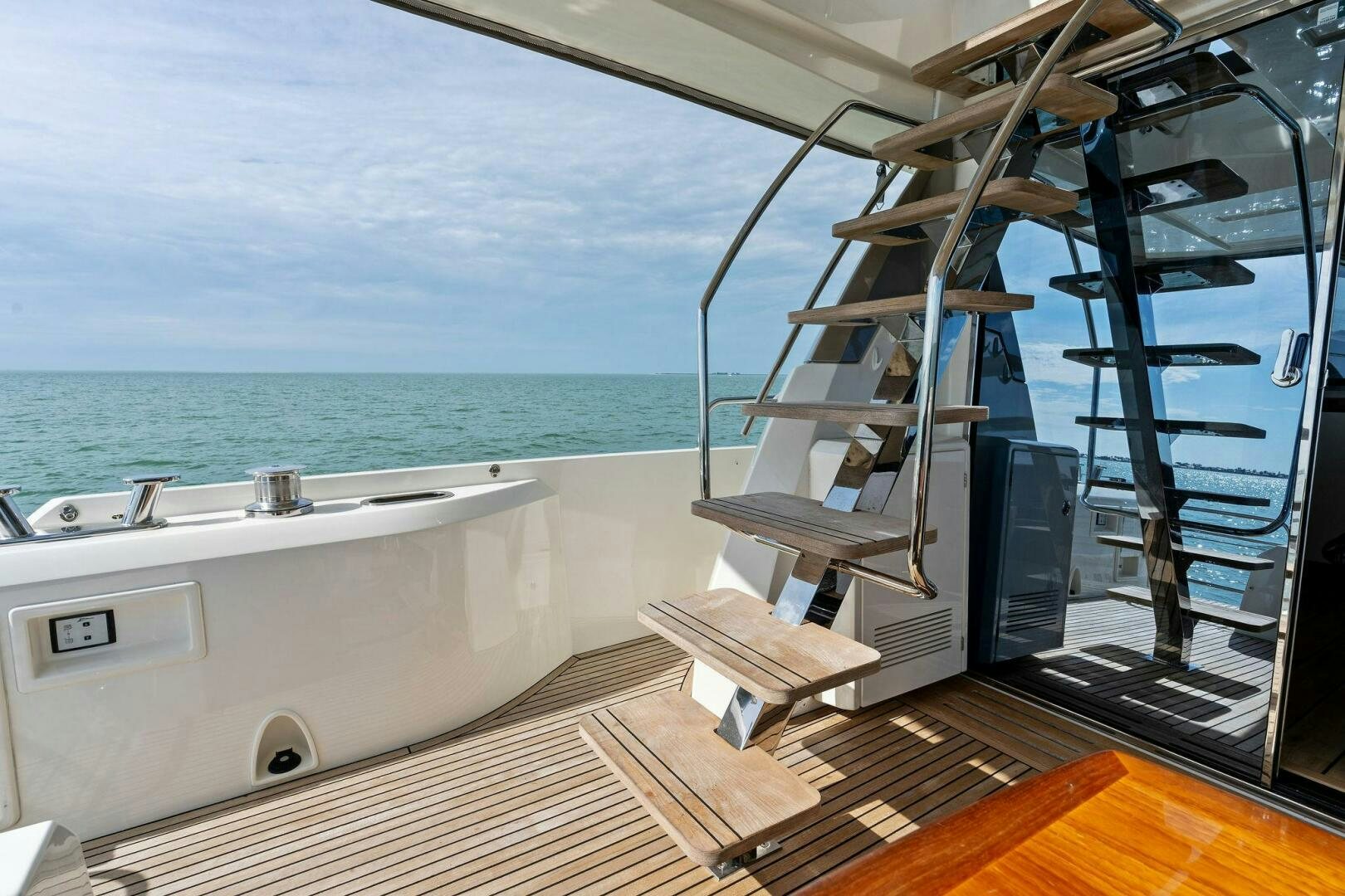 a large white boat on a deck aboard PRESTIGE WORLDWIDE Yacht for Sale