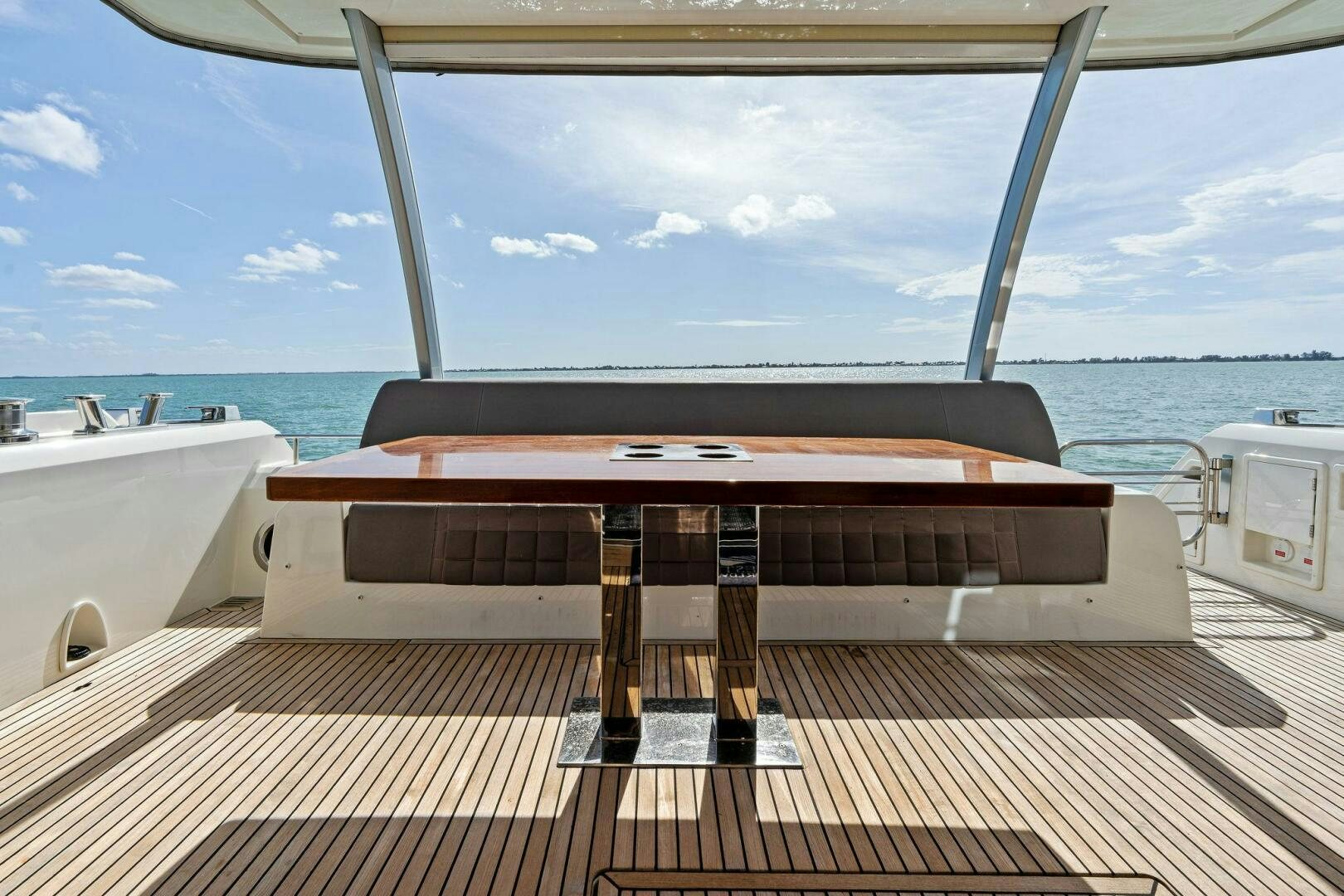 a table on a deck aboard PRESTIGE WORLDWIDE Yacht for Sale