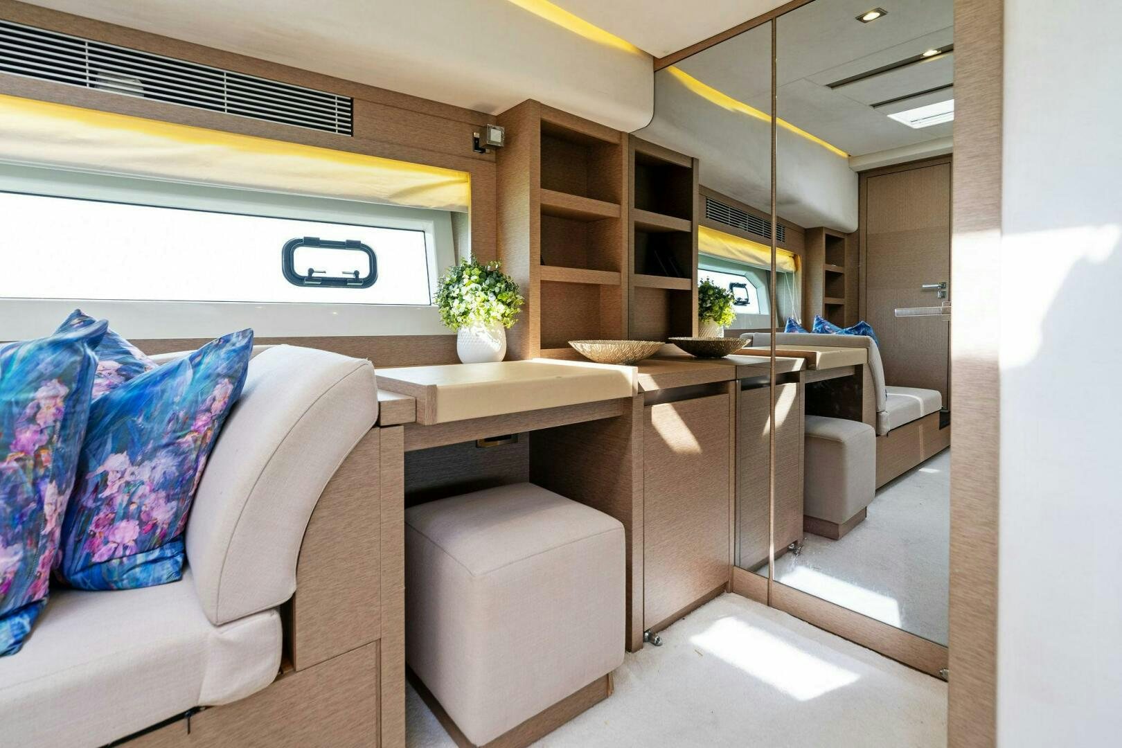 a room with a couch and a table aboard PRESTIGE WORLDWIDE Yacht for Sale