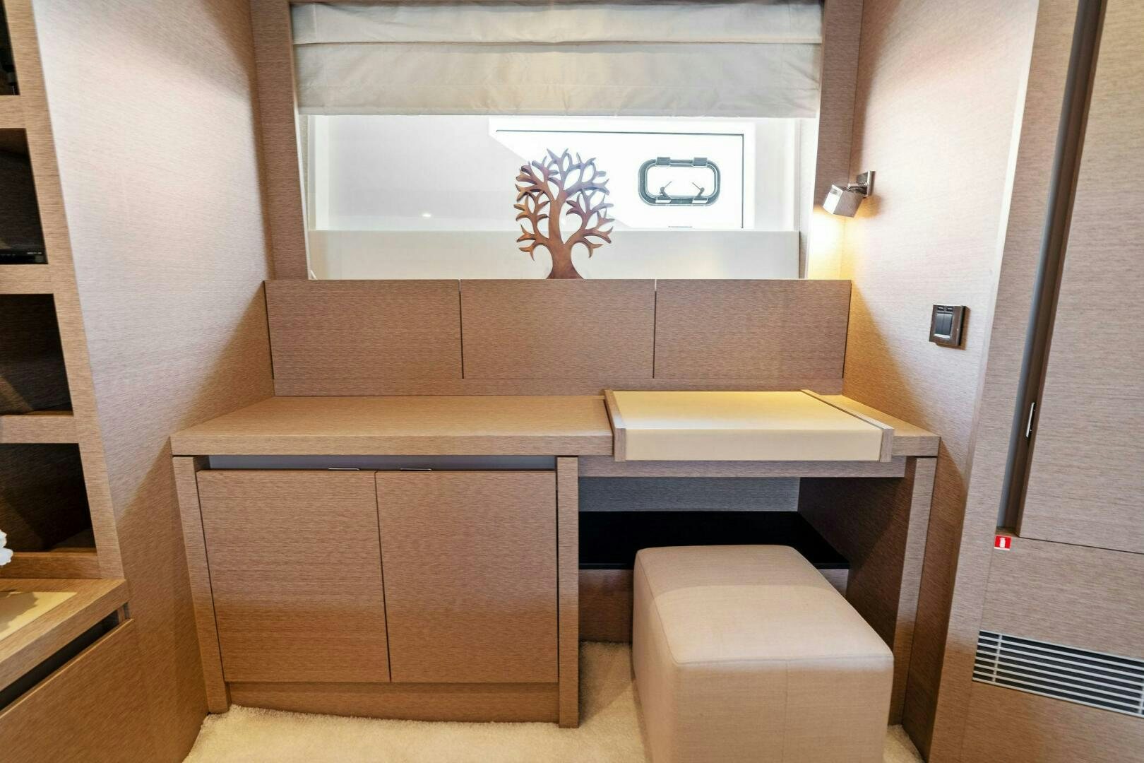 a room with a desk and a chair aboard PRESTIGE WORLDWIDE Yacht for Sale