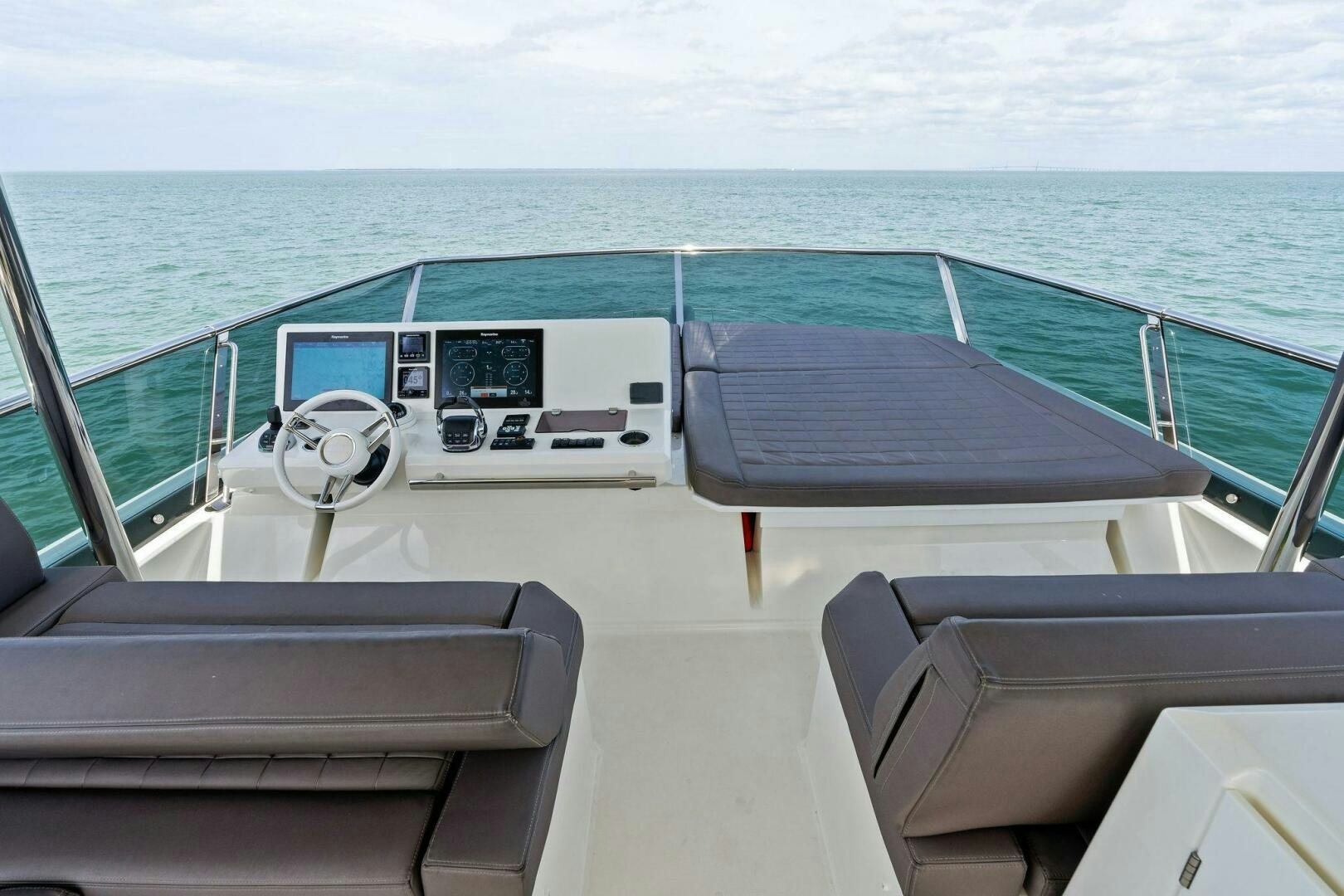 a boat on the water aboard PRESTIGE WORLDWIDE Yacht for Sale