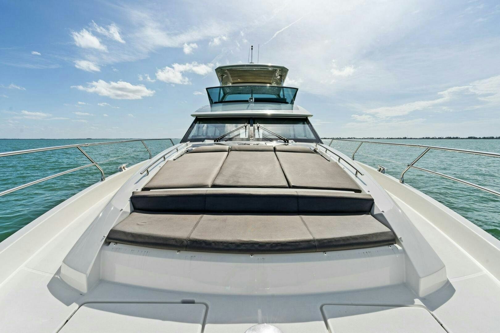 a boat on the water aboard PRESTIGE WORLDWIDE Yacht for Sale