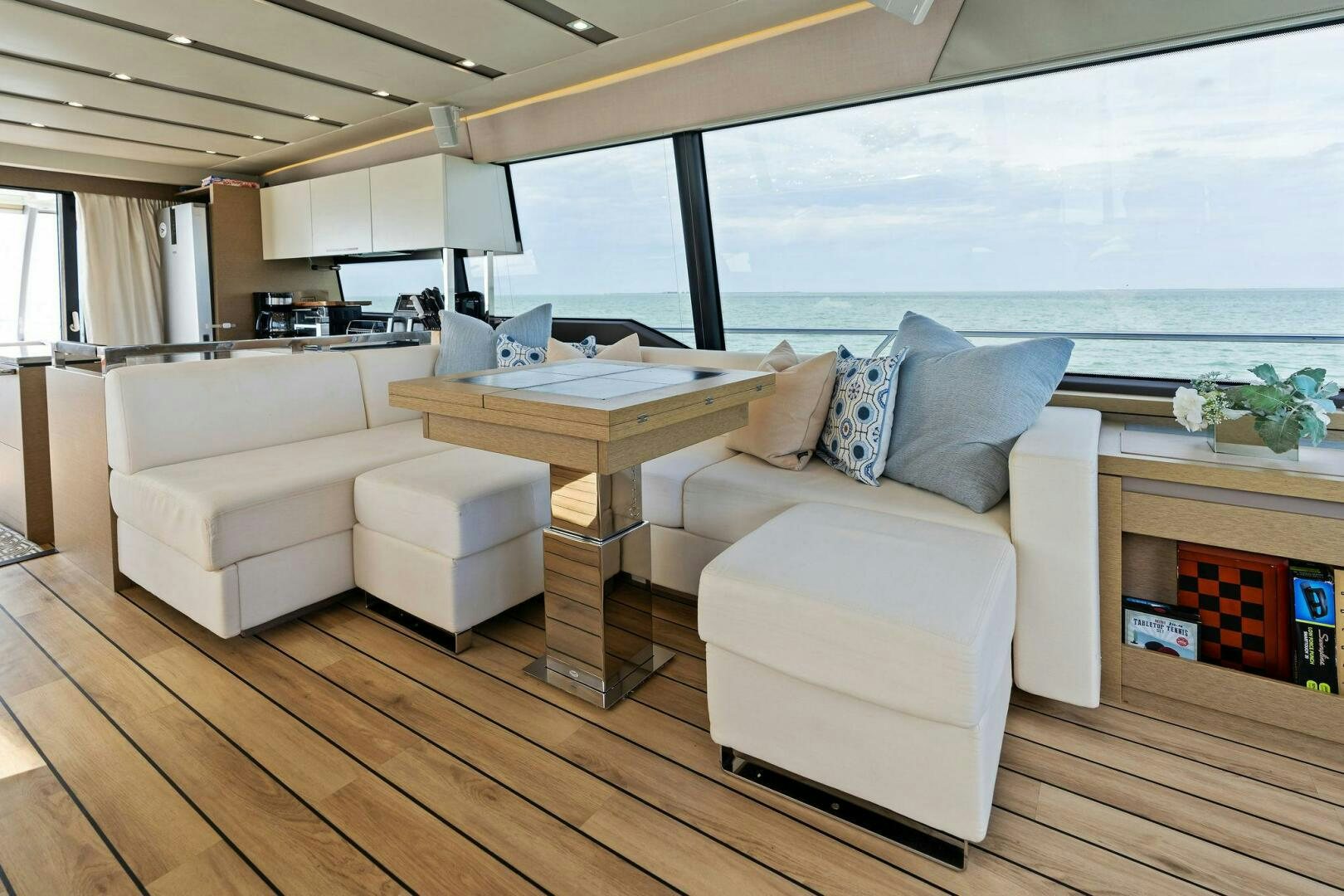 a living room with a large window aboard PRESTIGE WORLDWIDE Yacht for Sale