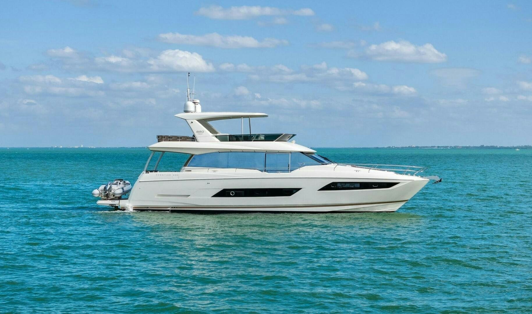 a boat in the water aboard PRESTIGE WORLDWIDE Yacht for Sale