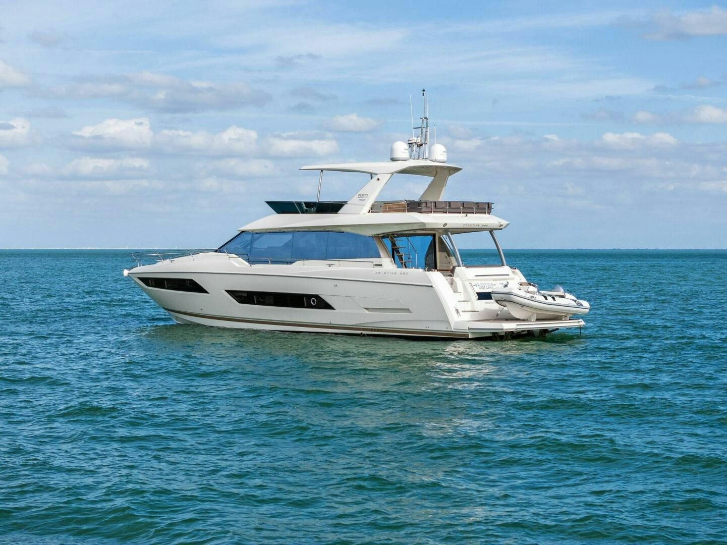 a white yacht in the water aboard PRESTIGE WORLDWIDE Yacht for Sale