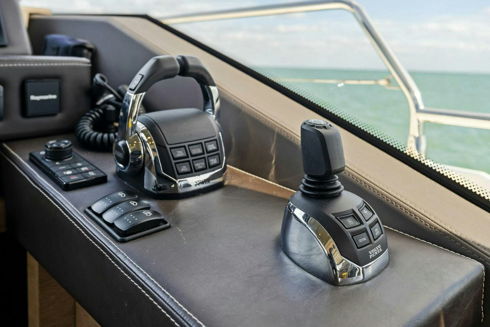 a black and silver telephone on a table aboard PRESTIGE WORLDWIDE Yacht for Sale