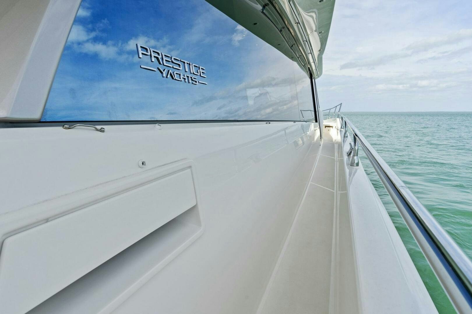 a boat on the water aboard PRESTIGE WORLDWIDE Yacht for Sale
