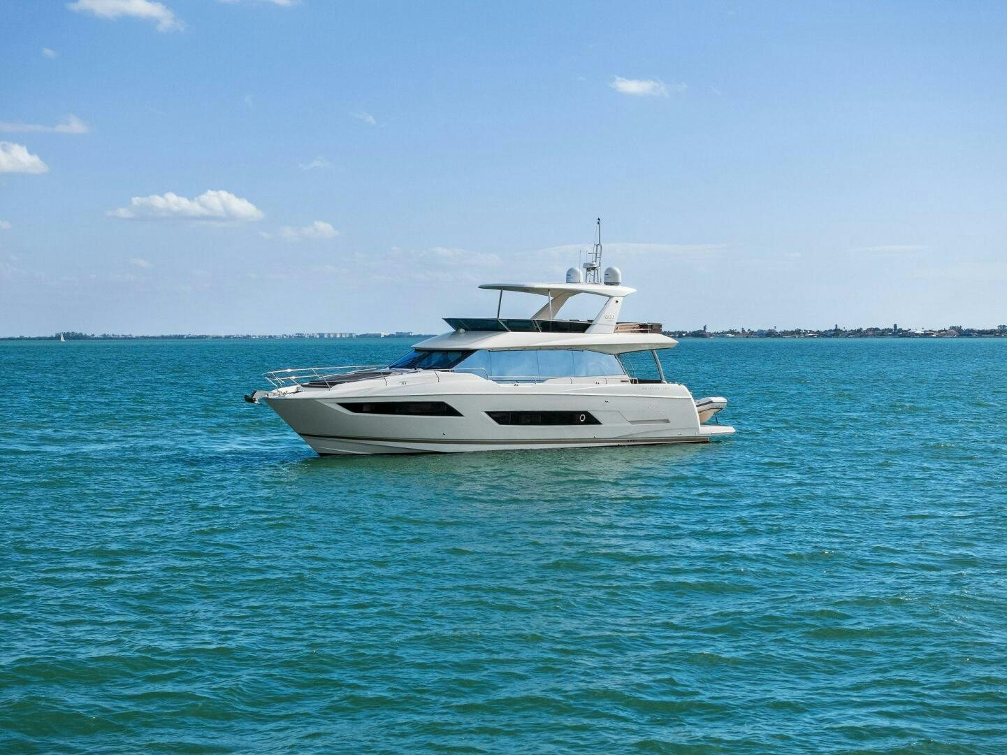 a white boat in the water aboard PRESTIGE WORLDWIDE Yacht for Sale
