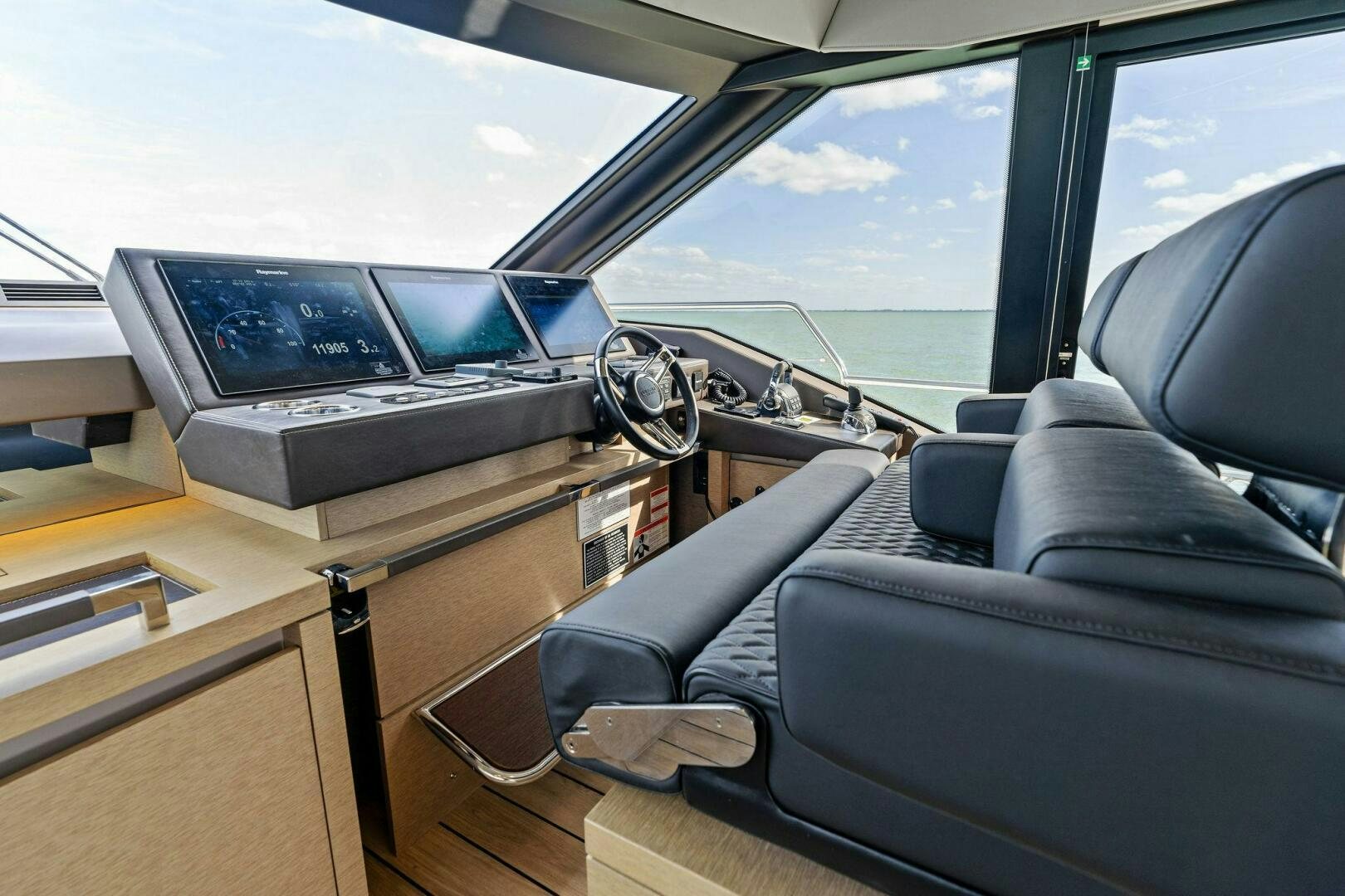 inside of a car with a laptop on the dashboard aboard PRESTIGE WORLDWIDE Yacht for Sale