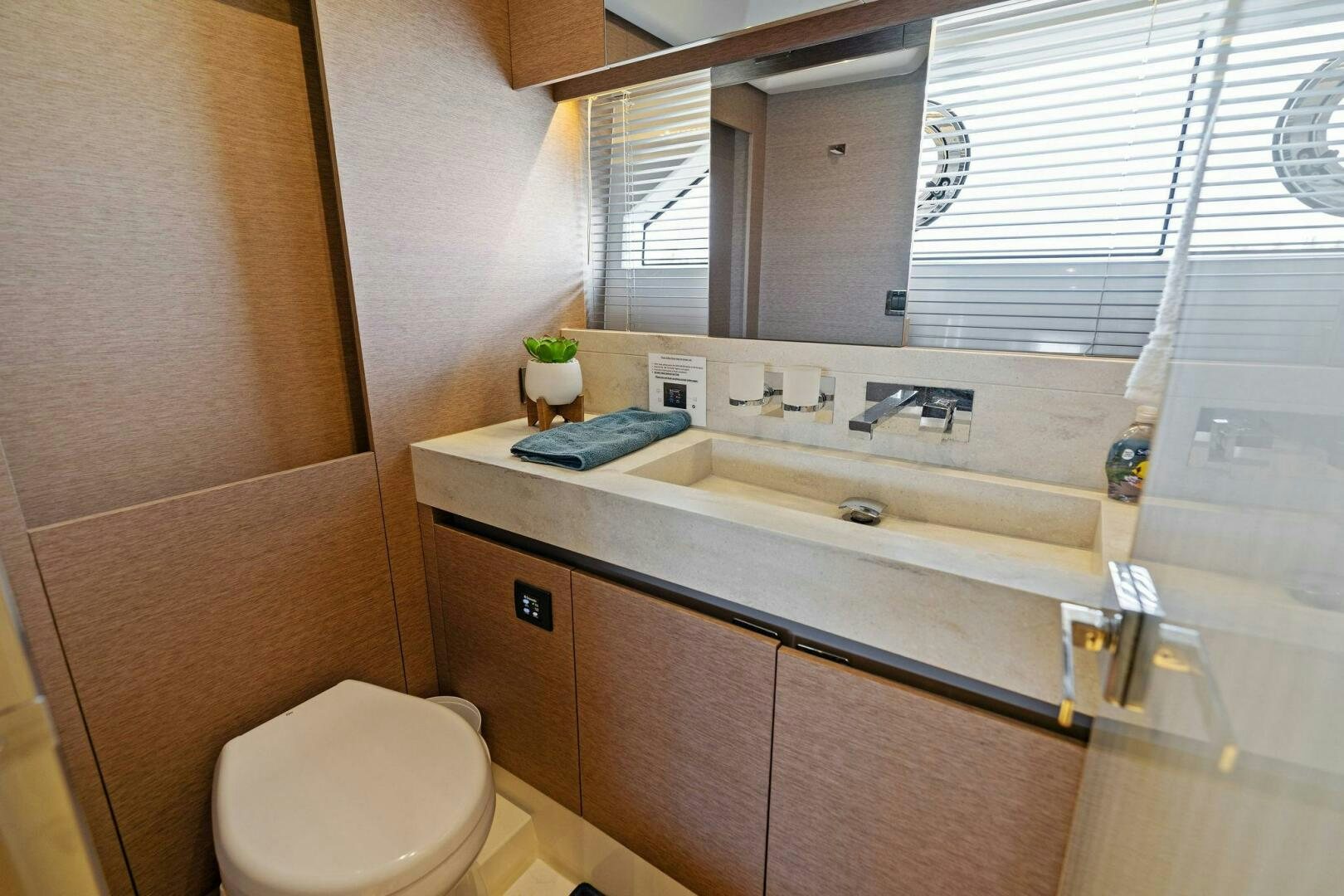 a bathroom with a sink and a toilet aboard PRESTIGE WORLDWIDE Yacht for Sale