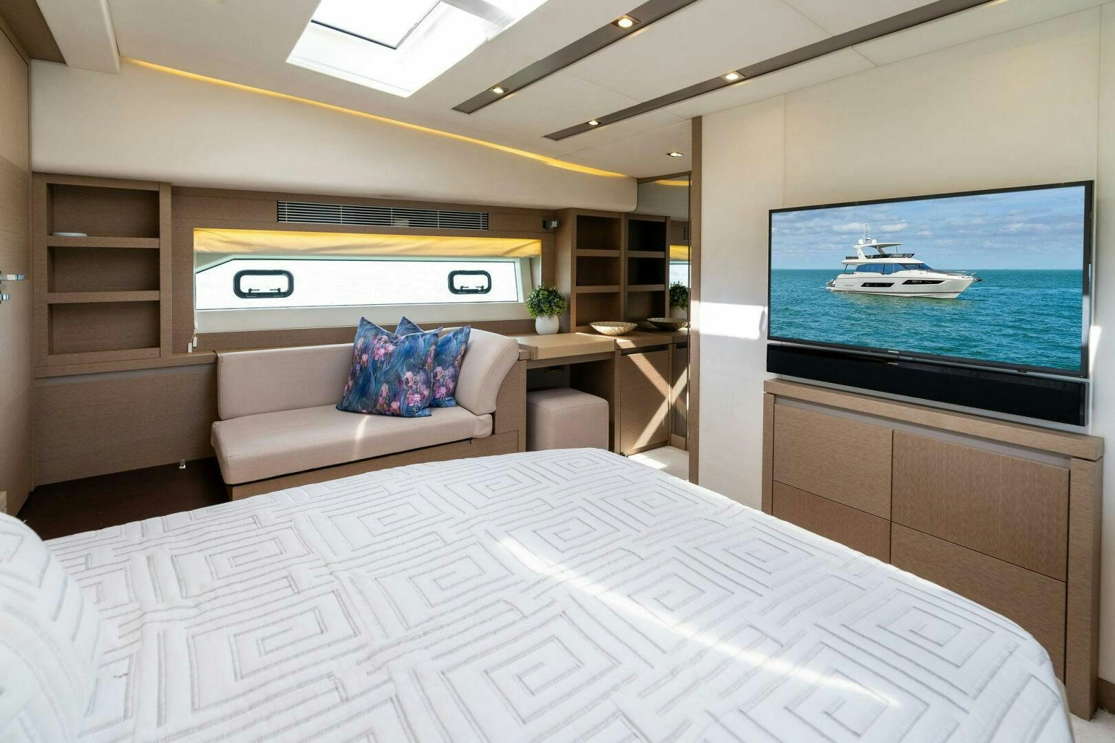 a room with a bed and a television aboard PRESTIGE WORLDWIDE Yacht for Sale