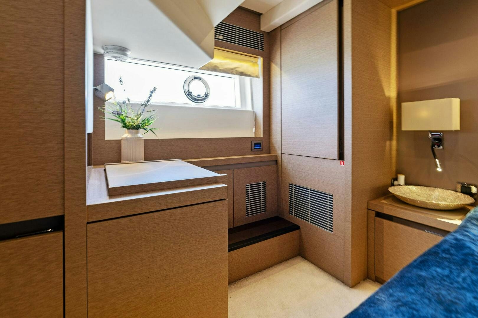 a bathroom with a sink and a mirror aboard PRESTIGE WORLDWIDE Yacht for Sale