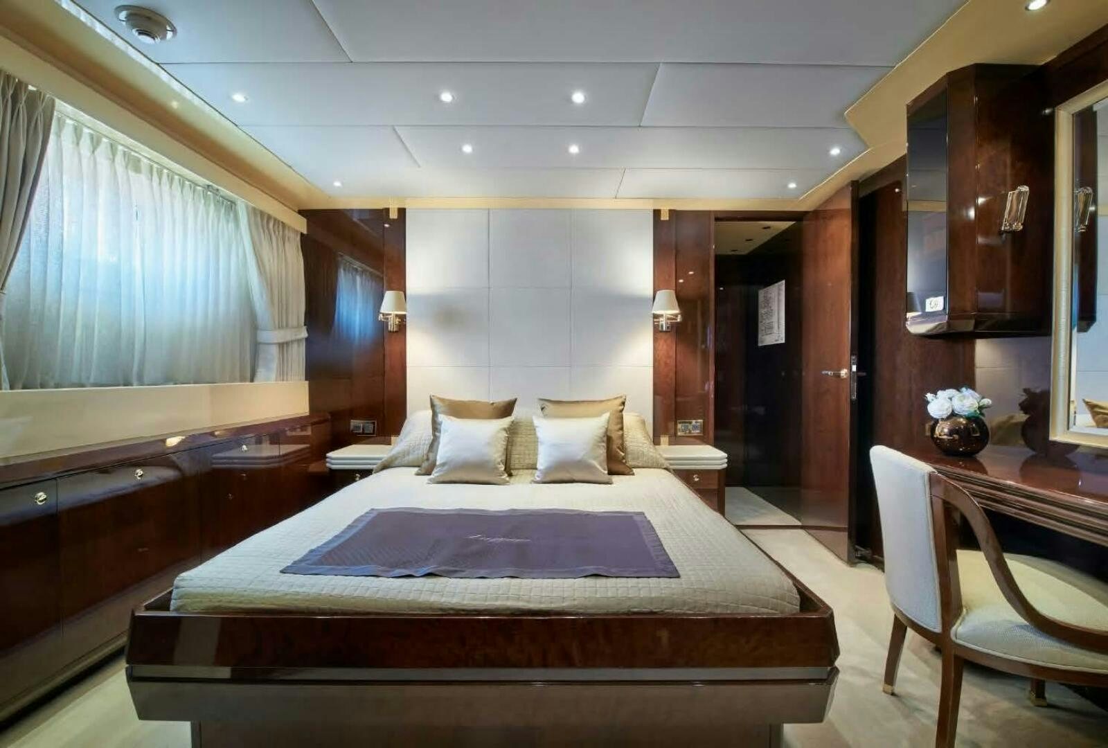 a large bedroom with a large bed aboard REARDEN STEEL Yacht for Sale