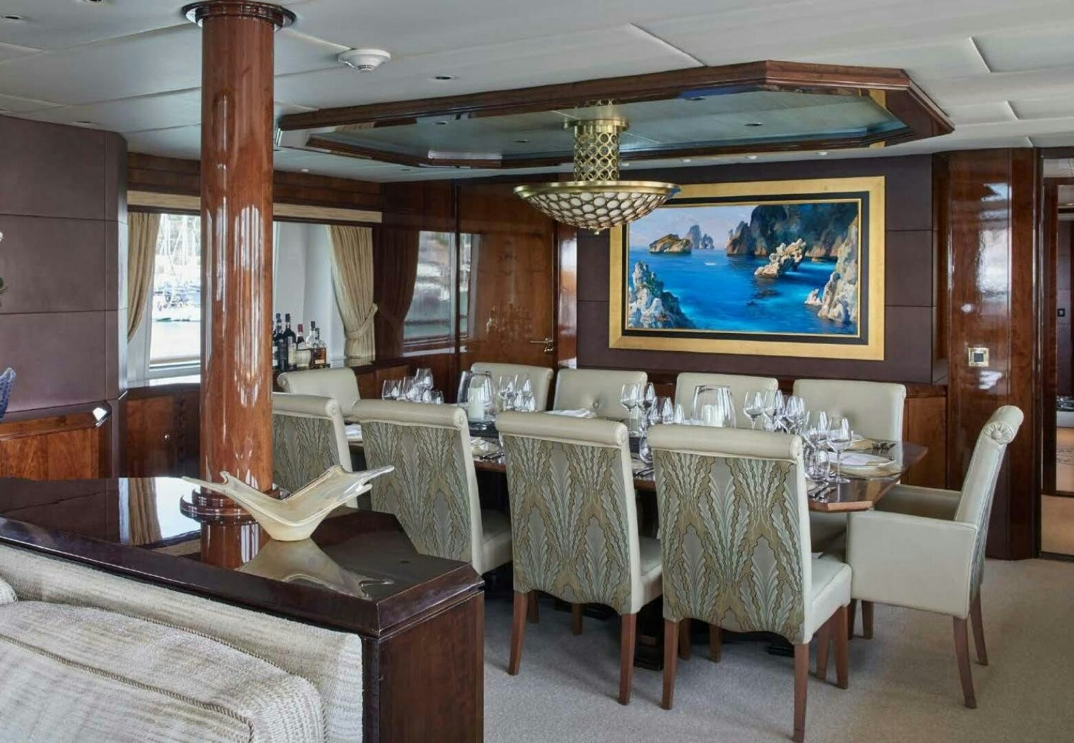 a room with a table and chairs aboard REARDEN STEEL Yacht for Sale