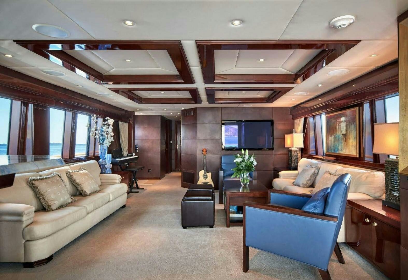 a living room with a large window aboard REARDEN STEEL Yacht for Sale
