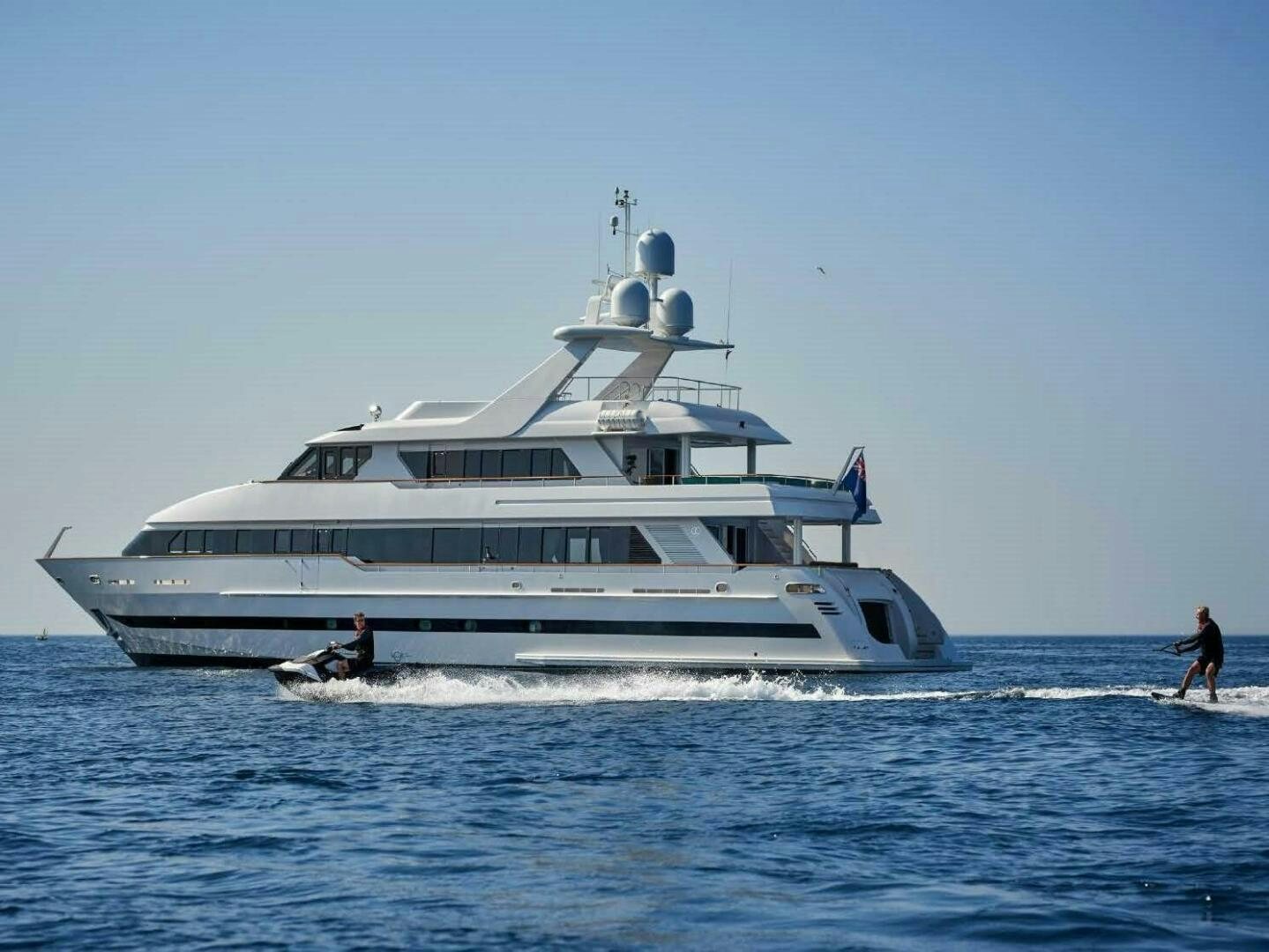 a large white boat with a person on it aboard REARDEN STEEL Yacht for Sale