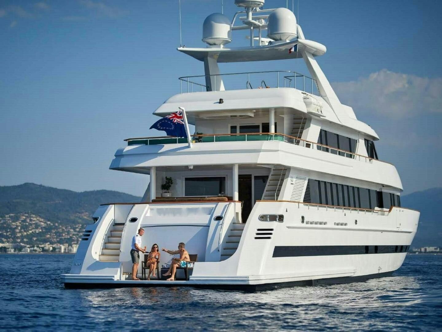 a large white boat with a group of people on it aboard REARDEN STEEL Yacht for Sale