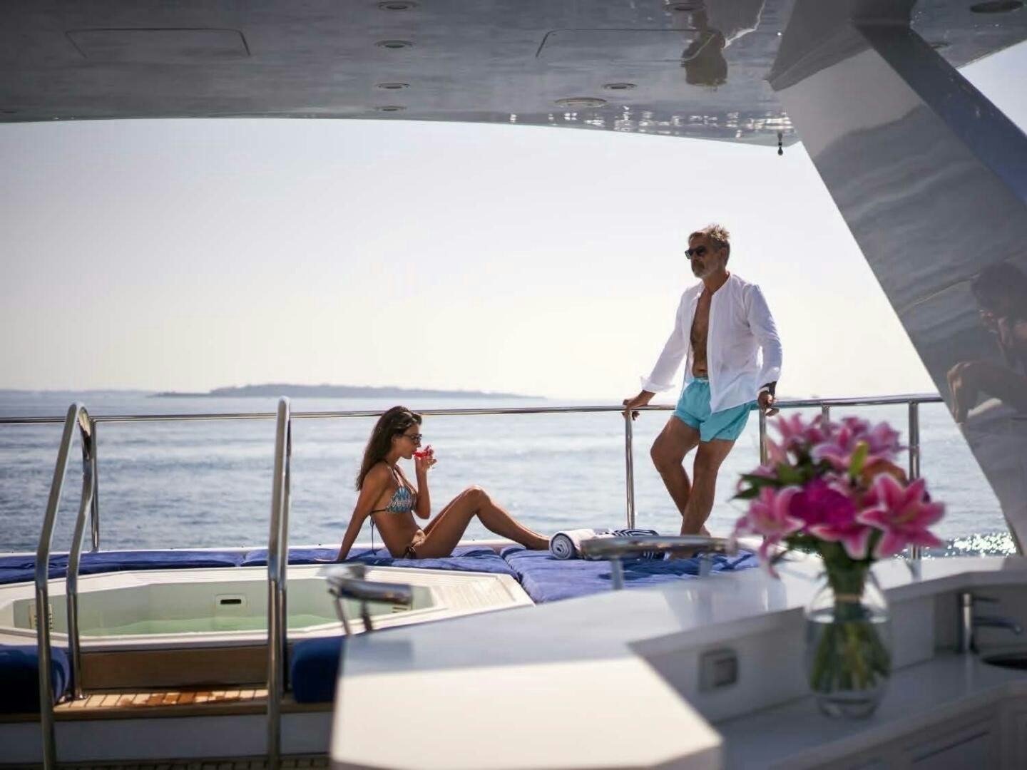 a man and woman on a boat aboard REARDEN STEEL Yacht for Sale