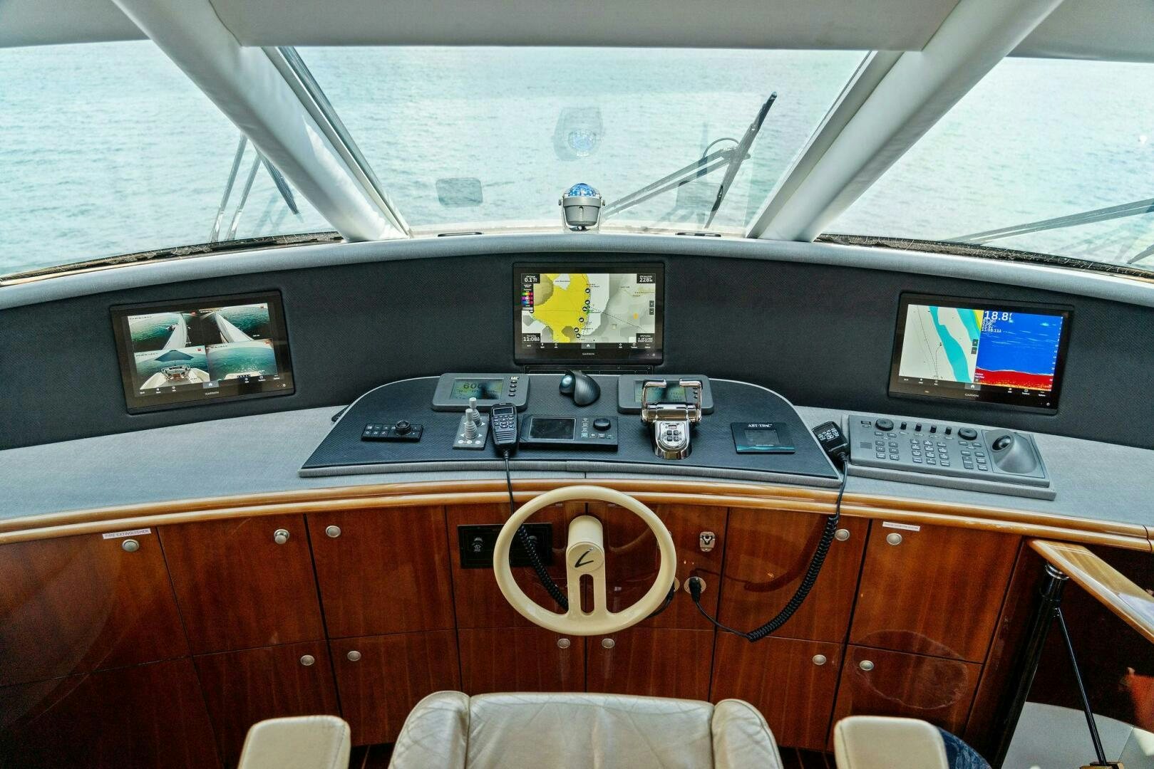 a control panel with a keyboard and monitor aboard CORAGGIO Yacht for Sale