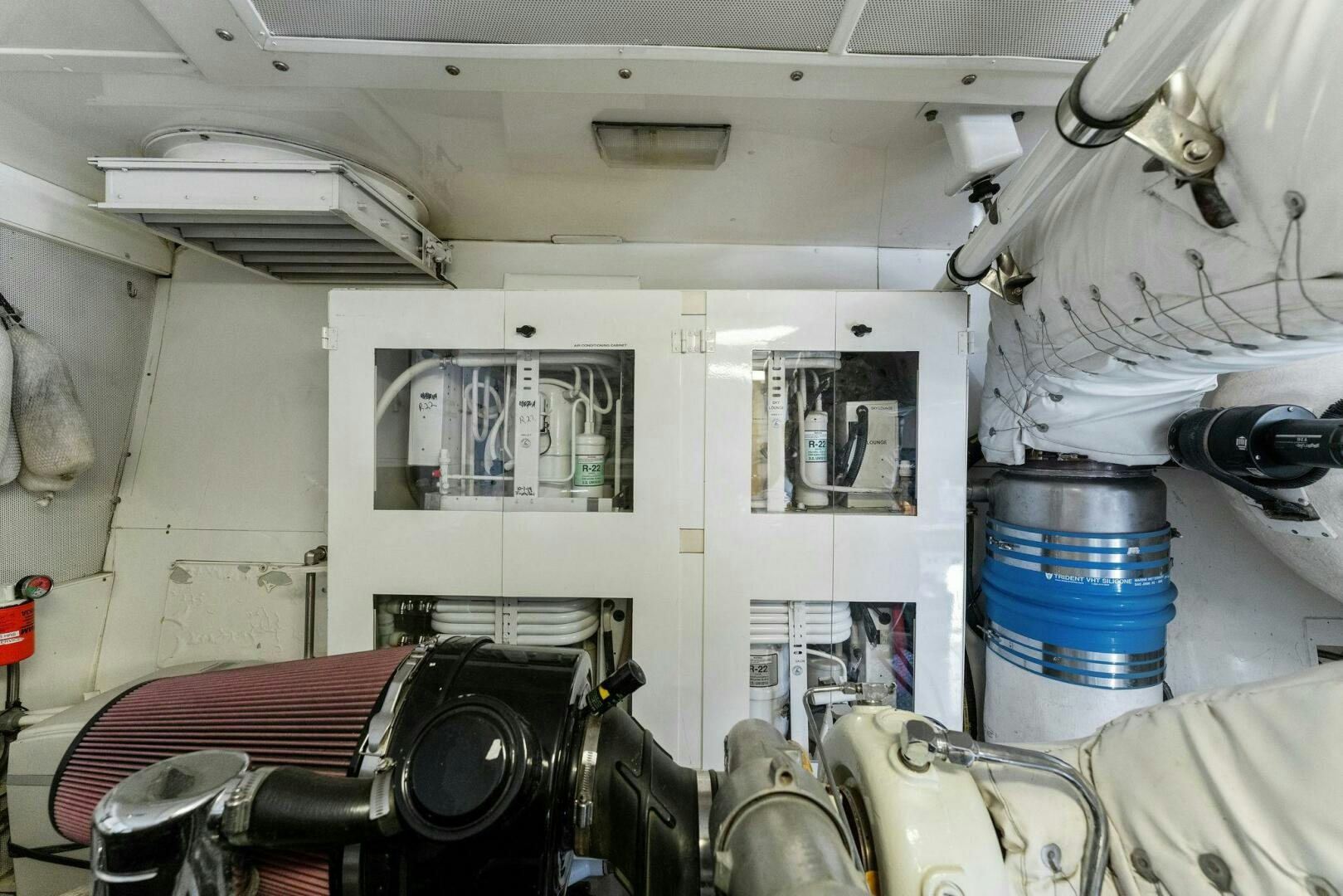 a room with a car and a large metal drum aboard CORAGGIO Yacht for Sale