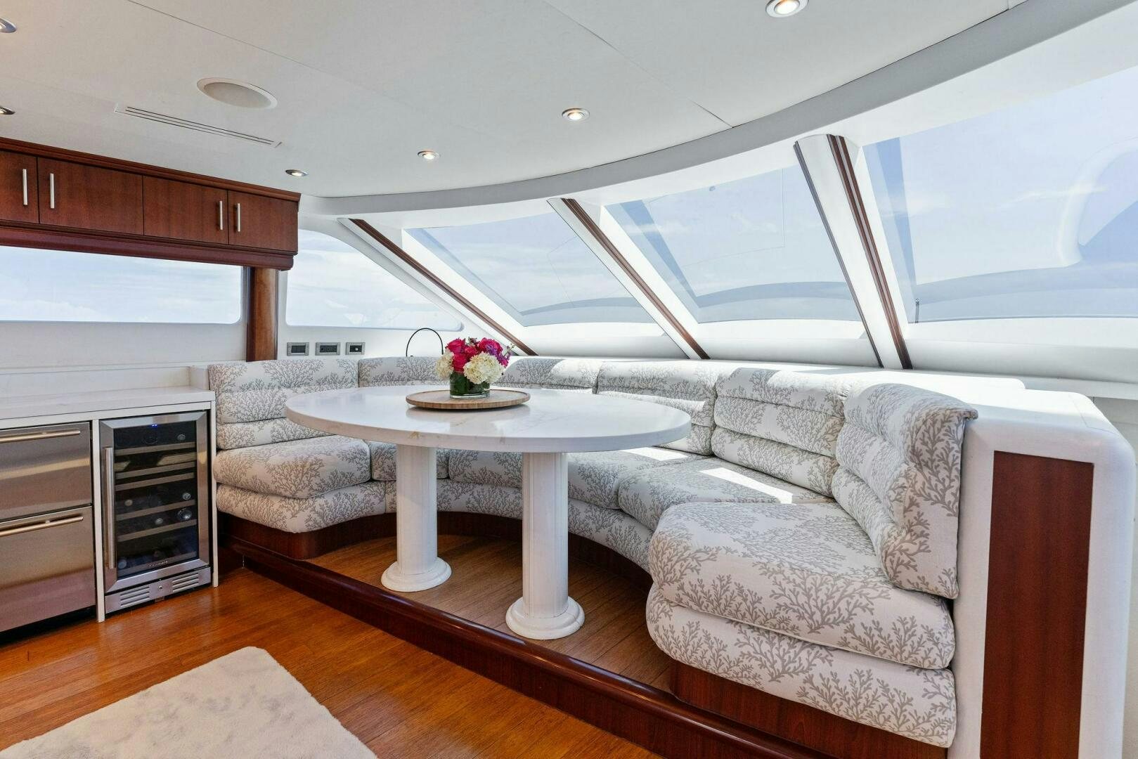 a living room with a couch and a table aboard CORAGGIO Yacht for Sale