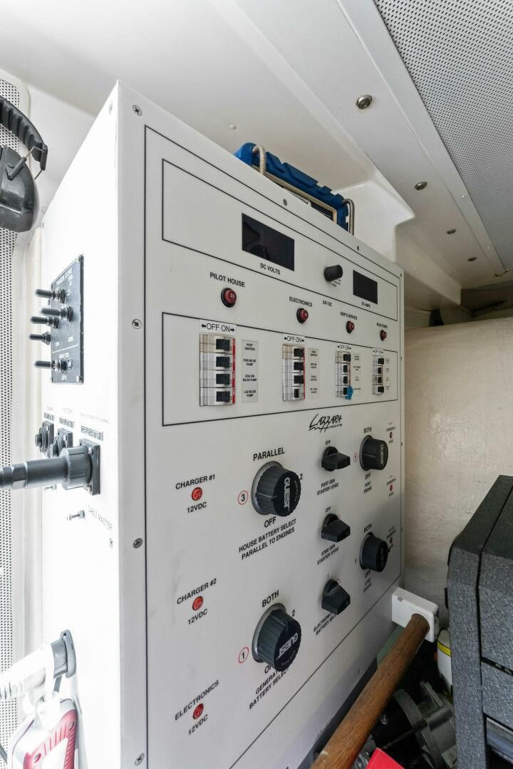 a white electrical device with black buttons aboard CORAGGIO Yacht for Sale