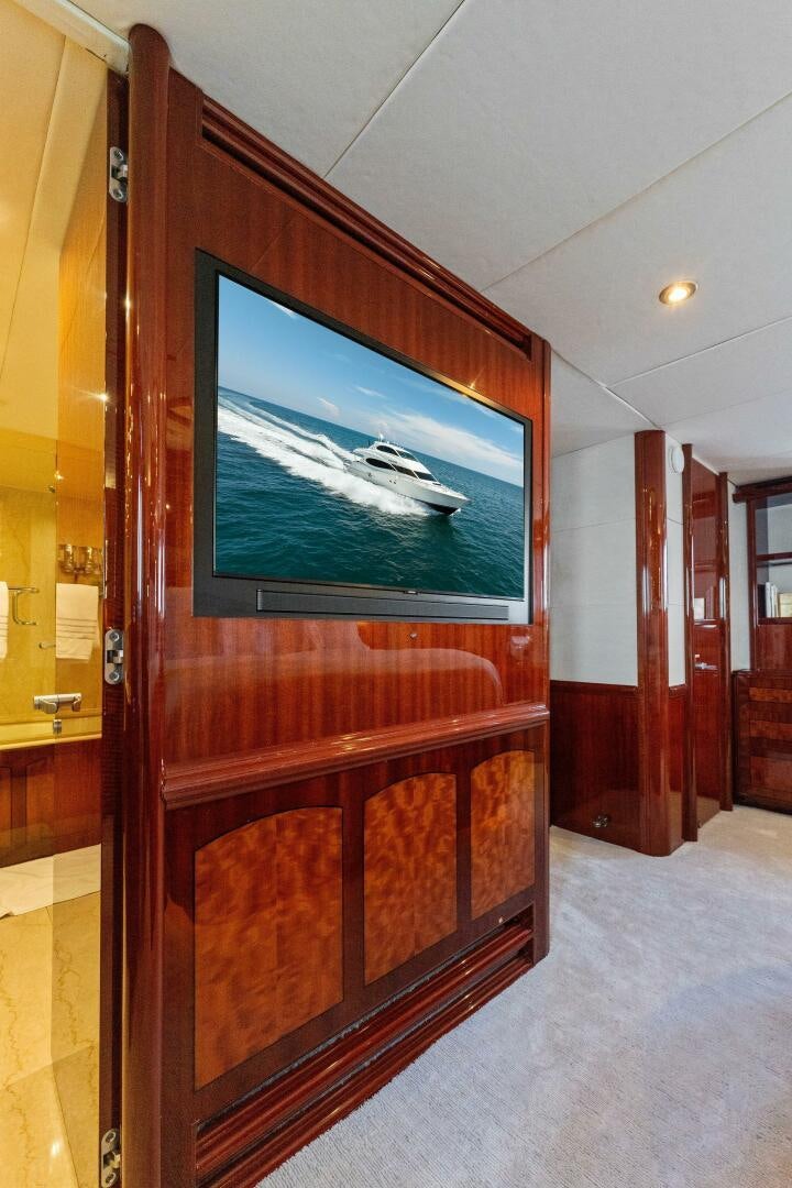 a tv on a wall aboard CORAGGIO Yacht for Sale