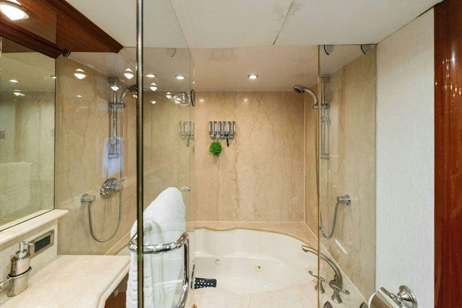 a bathroom with a bathtub and shower aboard CORAGGIO Yacht for Sale