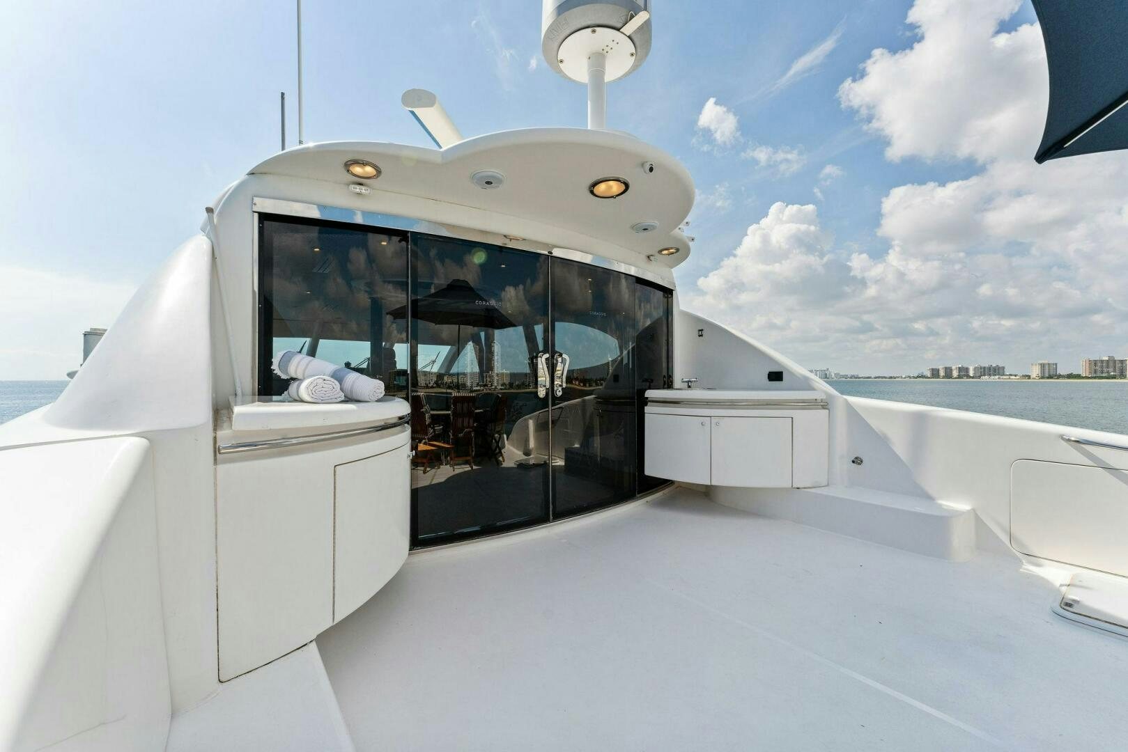 a white boat with a door open aboard CORAGGIO Yacht for Sale