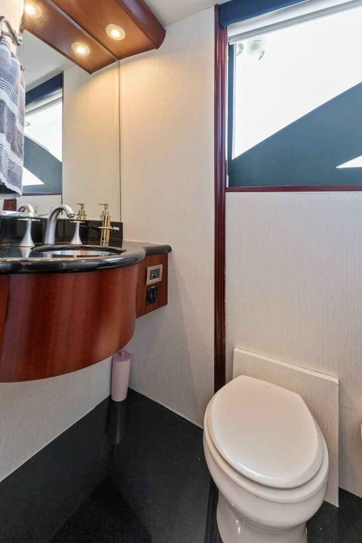 a bathroom with a sink and a toilet aboard CORAGGIO Yacht for Sale