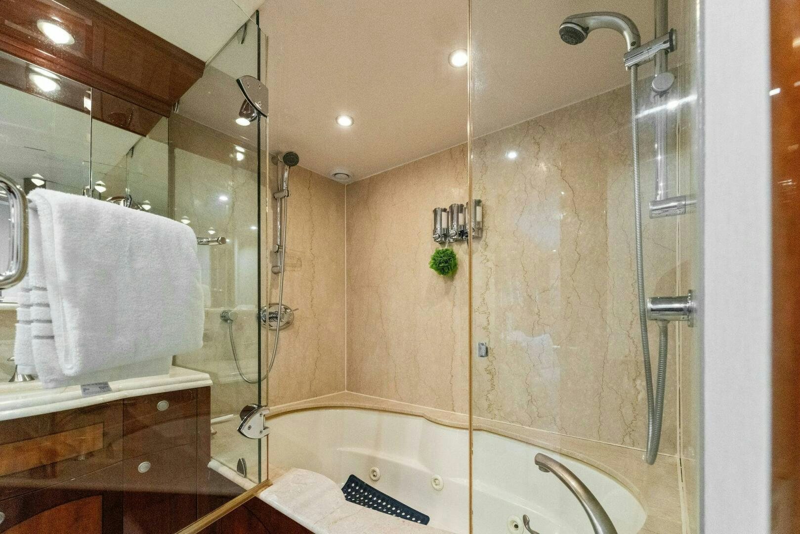 a bathroom with a glass shower aboard CORAGGIO Yacht for Sale