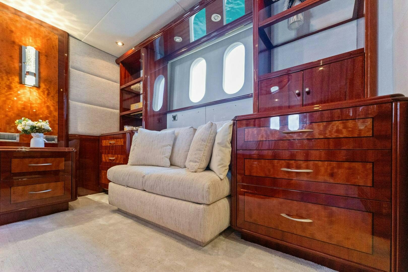 a living room with a couch and a cupboard aboard CORAGGIO Yacht for Sale