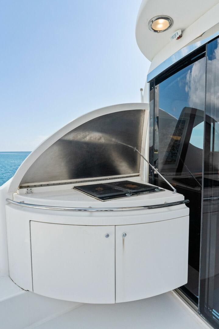 a white machine with a laptop on top aboard CORAGGIO Yacht for Sale
