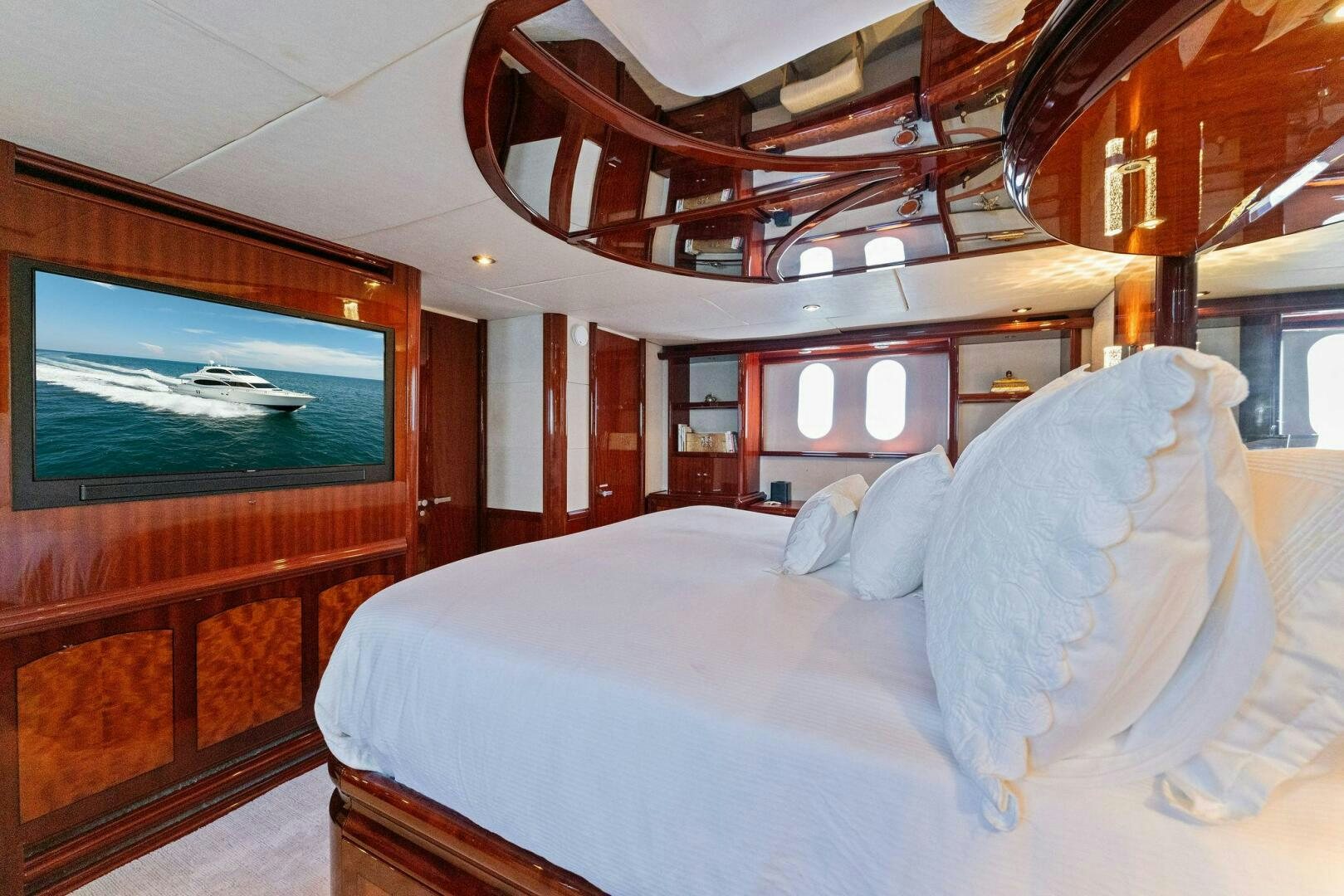 a bed with a white sheet aboard CORAGGIO Yacht for Sale