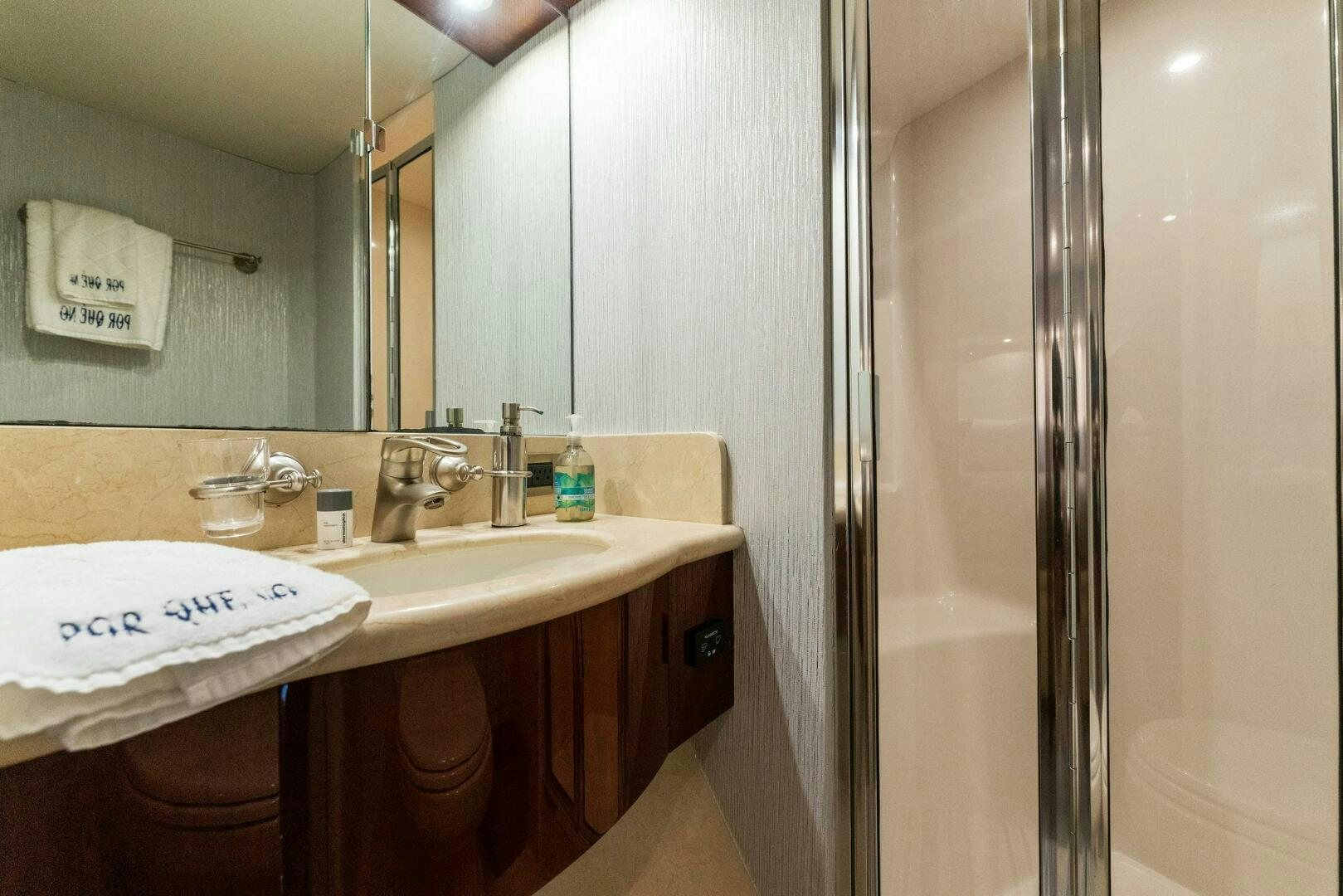 a bathroom with a sink and a shower aboard CORAGGIO Yacht for Sale