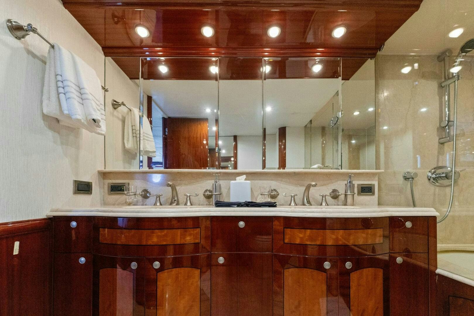 a kitchen with wooden cabinets aboard CORAGGIO Yacht for Sale