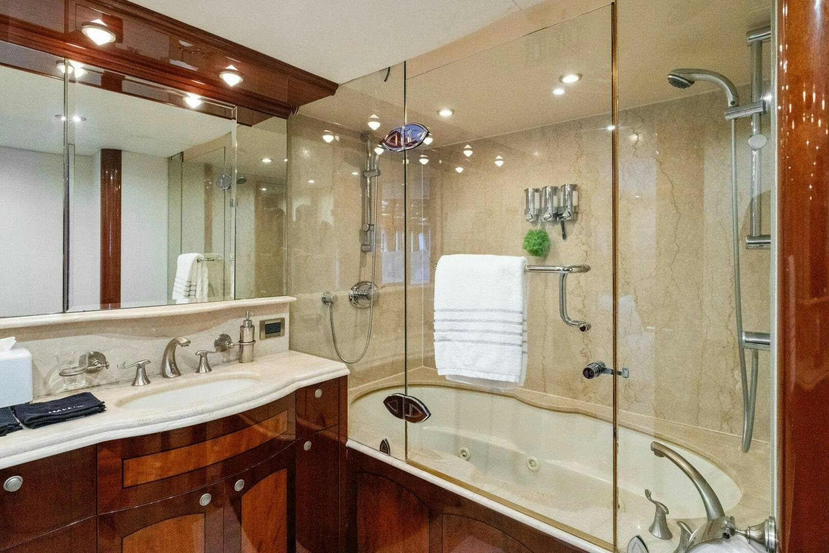 a bathroom with a large glass shower aboard CORAGGIO Yacht for Sale
