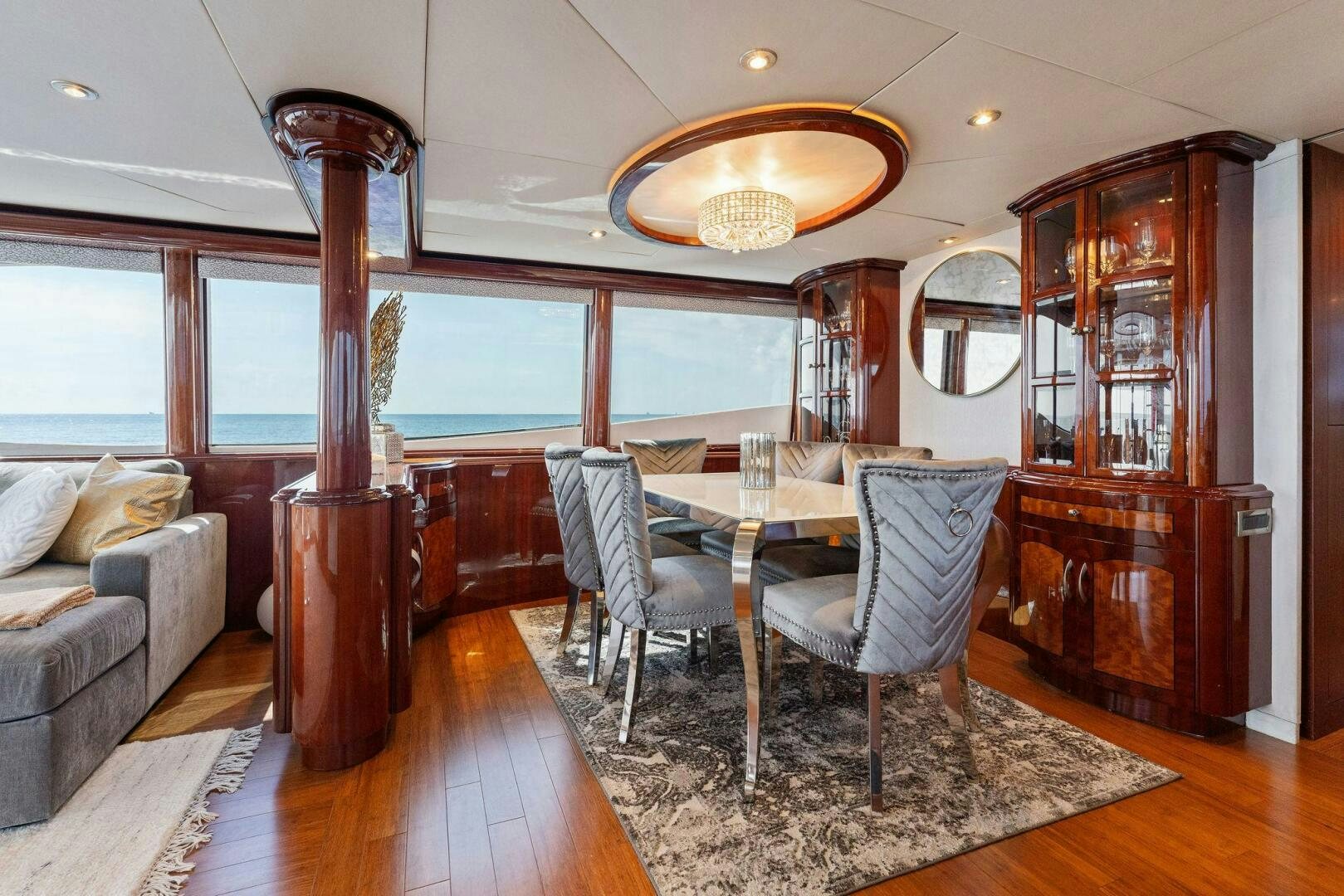 a dining room with a large mirror aboard CORAGGIO Yacht for Sale