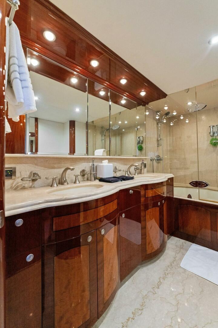 a bathroom with a large mirror aboard CORAGGIO Yacht for Sale