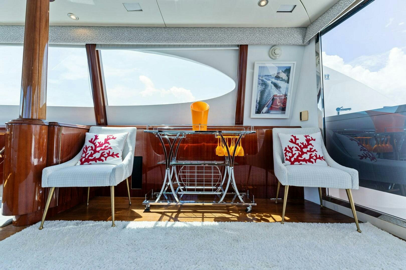 a table and chairs in a room aboard CORAGGIO Yacht for Sale