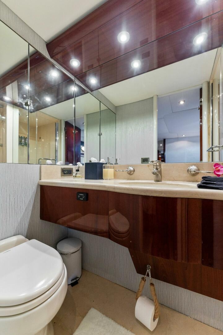 a bathroom with a large mirror aboard CORAGGIO Yacht for Sale