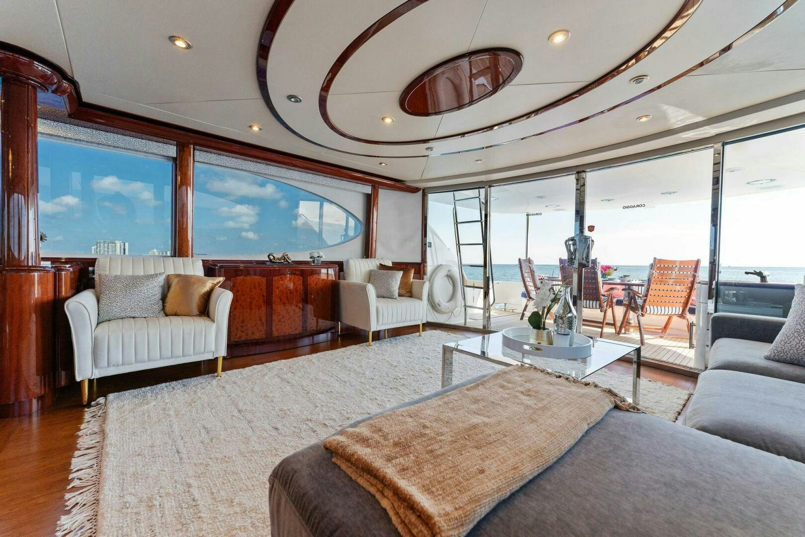 a living room with a large window aboard CORAGGIO Yacht for Sale