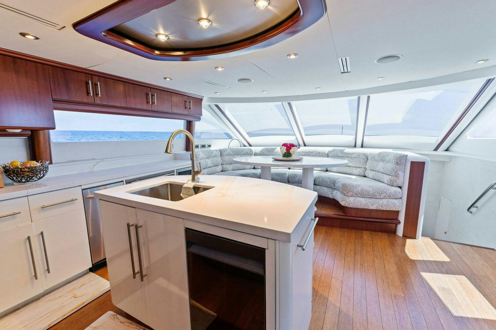 a kitchen with a sink and a couch aboard CORAGGIO Yacht for Sale