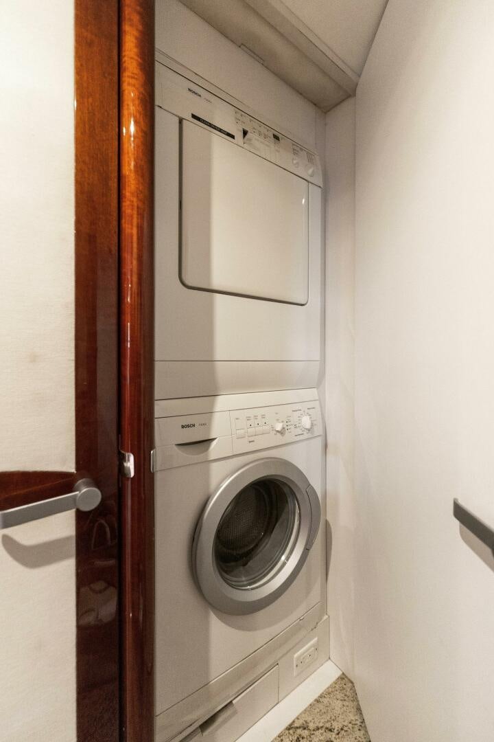 a washer and dryer in a room aboard CORAGGIO Yacht for Sale