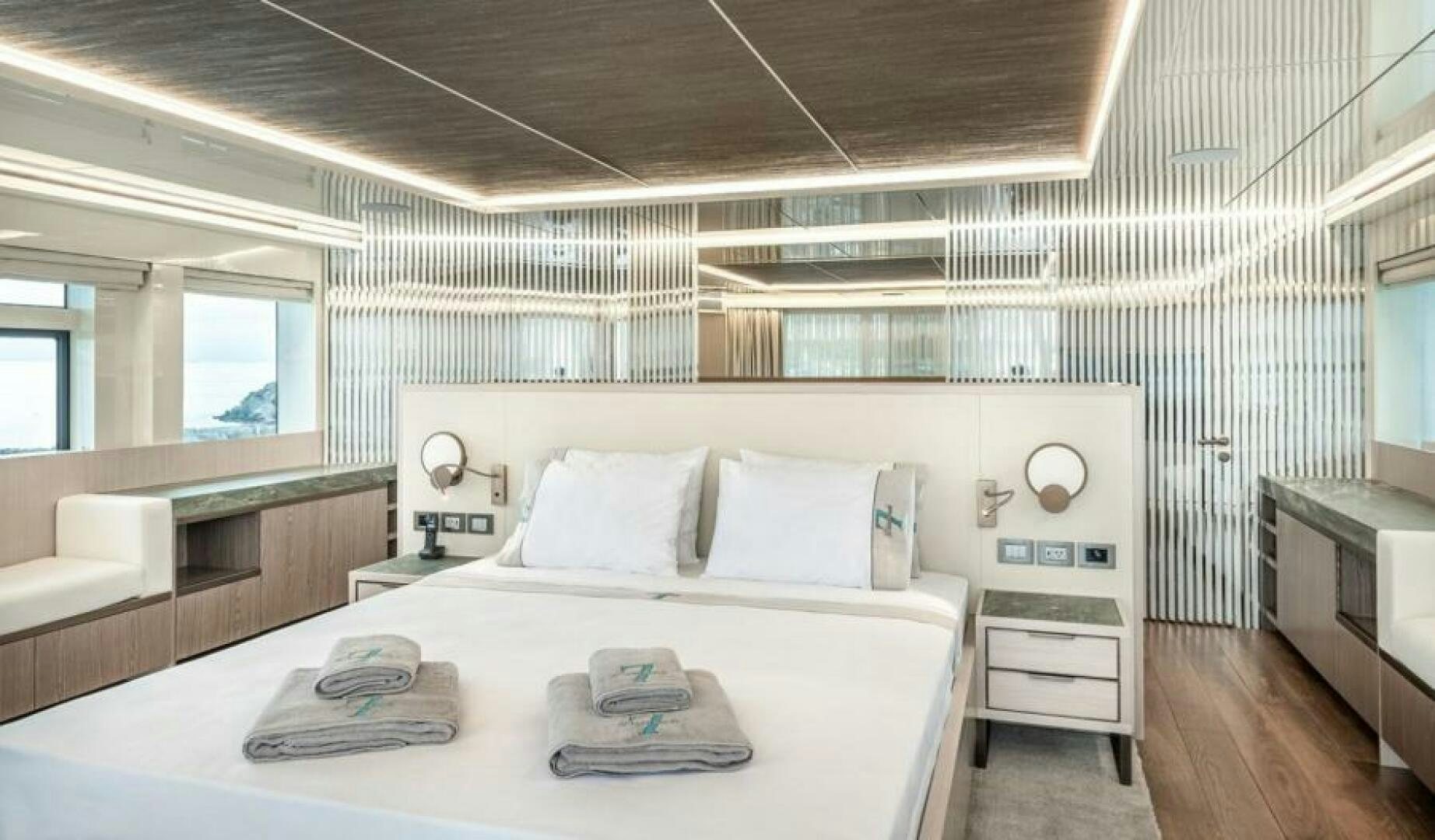 a large white bed in a room aboard NUMARINE 32XP HULL 6 Yacht for Sale