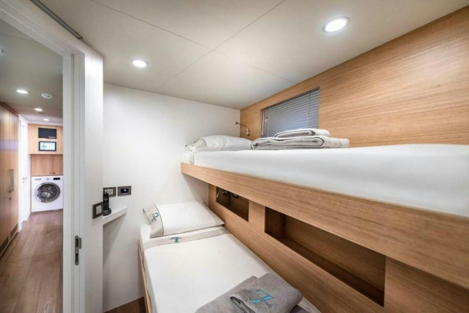 a room with a bed and a wood floor aboard NUMARINE 32XP HULL 6 Yacht for Sale