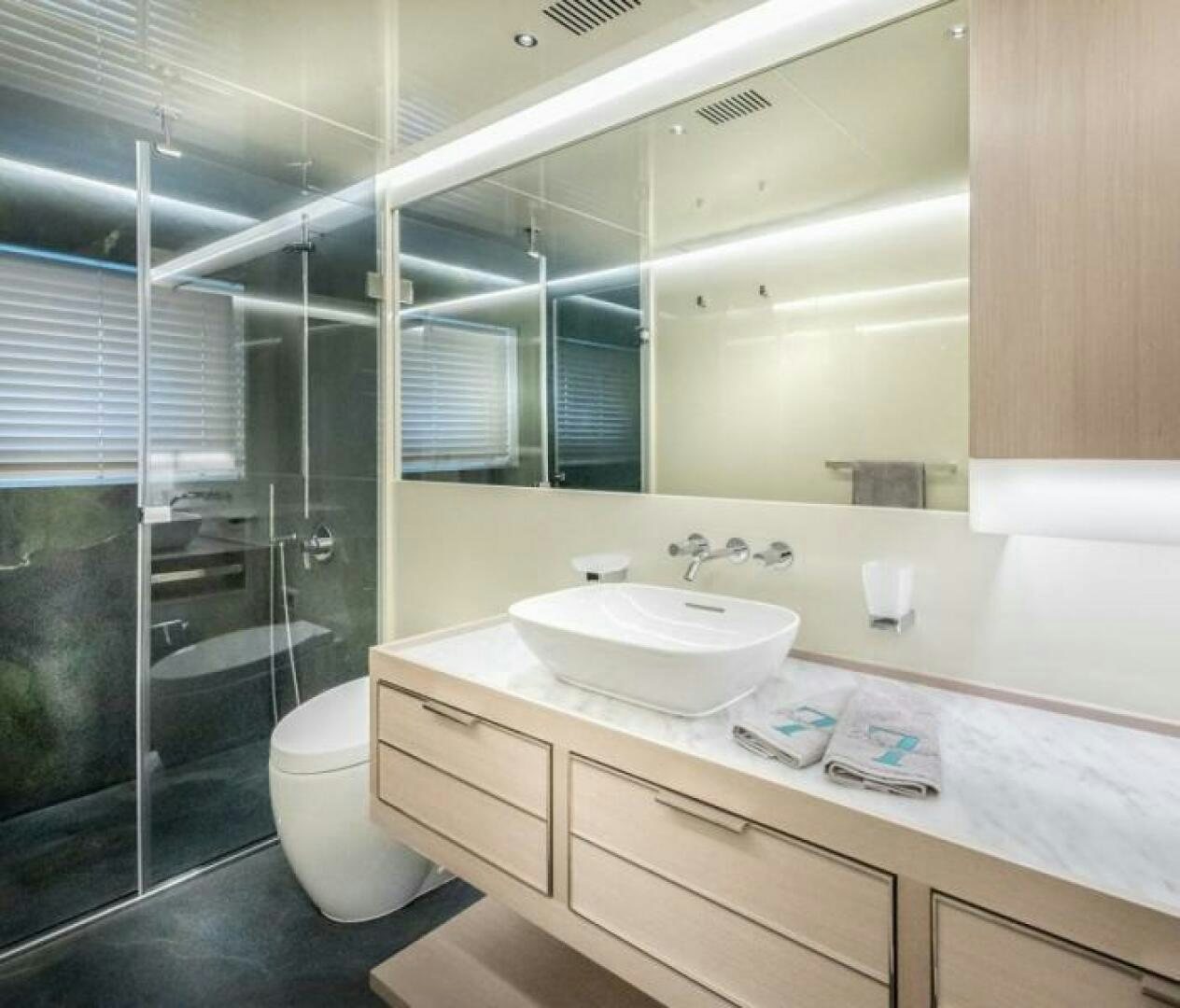 a bathroom with a glass shower aboard NUMARINE 32XP HULL 6 Yacht for Sale